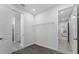 Spacious closet area with shelving, neutral paint and plush carpeting adding comfort and function at 18743 Overton St, Orlando, FL 32833