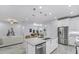Bright and open concept kitchen with stainless appliances, granite counters, and lots of storage at 18743 Overton St, Orlando, FL 32833