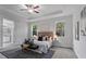 Serene main bedroom with a tray ceiling, carpet, and natural light at 18743 Overton St, Orlando, FL 32833