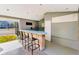 Community outdoor bar area featuring a sink, several chairs and a view of the tennis court at 2216 Stonington Ave # 2216, Orlando, FL 32817