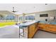 Community outdoor bar area featuring wood cabinets and a sink overlooking the tennis courts at 2216 Stonington Ave # 2216, Orlando, FL 32817