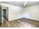 Bright bedroom features a ceiling fan and open access to other areas of the house at 2216 Stonington Ave # 2216, Orlando, FL 32817