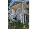 Condo exterior featuring stairs to upper units with lush greenery at 2216 Stonington Ave # 2216, Orlando, FL 32817