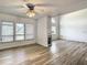 Open-concept living room featuring fireplace, fan, and lots of windows at 2216 Stonington Ave # 2216, Orlando, FL 32817