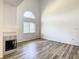Bright living room featuring a fireplace, modern flooring, and large windows allowing ample natural light at 2216 Stonington Ave # 2216, Orlando, FL 32817