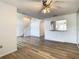 Spacious living room featuring pass-through to kitchen and stairs at 2216 Stonington Ave # 2216, Orlando, FL 32817