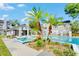 Community pool and lounge area, framed by palms and manicured landscape in a park-like setting at 2216 Stonington Ave # 2216, Orlando, FL 32817