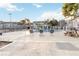 Inviting community pool with lounge chairs, picnic table, and views of well-maintained condo buildings at 2216 Stonington Ave # 2216, Orlando, FL 32817