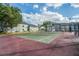 Well-maintained tennis court, surrounded by mature trees and condo buildings at 2216 Stonington Ave # 2216, Orlando, FL 32817