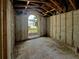 Renovation project: interior framing showing a bright window offering a beautiful neighborhood view at 2226 Newt St, Orlando, FL 32837