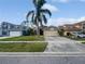 Suburban home showcasing mature landscaping, two-car garage, neutral paint, and well-manicured lawn at 2226 Newt St, Orlando, FL 32837