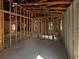 Spacious interior view showcasing wooden framing in a home renovation project, light coming through the windows at 2226 Newt St, Orlando, FL 32837