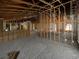 Spacious interior with structural framing and unfinished walls, showing the progress of renovation at 2226 Newt St, Orlando, FL 32837