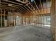 Spacious home interior awaiting renovation with exposed ceiling, arched entryway, and abundant natural light at 2226 Newt St, Orlando, FL 32837
