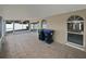 Covered patio with tiled floor and arched windows, with trash cans at 2226 Newt St, Orlando, FL 32837