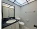 Well-maintained bathroom with neutral colors, a sink and a toilet at 2349 Oak Park Way # 107, Orlando, FL 32822