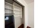 Organized closet with white shelving units and plenty of storage space at 2349 Oak Park Way # 107, Orlando, FL 32822
