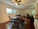 Cozy dining area features hardwood floors and adjacent living area view at 2349 Oak Park Way # 107, Orlando, FL 32822