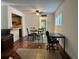 Cozy dining area features hardwood floors and adjacent kitchen view at 2349 Oak Park Way # 107, Orlando, FL 32822