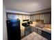 Functional kitchen features stainless steel appliances and laminate cabinets at 2349 Oak Park Way # 107, Orlando, FL 32822