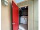 Convenient laundry room with washer, dryer, and shelving for storage at 2349 Oak Park Way # 107, Orlando, FL 32822