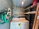 Laundry room with washer, dryer, wire shelving, and storage accessories at 2349 Oak Park Way # 107, Orlando, FL 32822