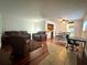 Bright open concept living area with hardwood floors at 2349 Oak Park Way # 107, Orlando, FL 32822