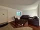 Inviting living room with hardwood floors and neutral paint at 2349 Oak Park Way # 107, Orlando, FL 32822
