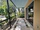 Screened patio offers an outdoor area with a tile floor and a scenic view at 2349 Oak Park Way # 107, Orlando, FL 32822