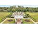 An aerial shot of an outdoor garden with plots, walkways, gazebo and manicured landscaping at 2362 Datura Loop, St Cloud, FL 34772