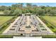 An aerial shot of an outdoor garden with plots, walkways and manicured landscaping at 2362 Datura Loop, St Cloud, FL 34772