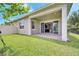 Enjoy this covered patio and spacious backyard, perfect for outdoor entertaining at 2362 Datura Loop, St Cloud, FL 34772