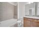 Bathroom featuring a shower-tub combo and granite vanity at 2362 Datura Loop, St Cloud, FL 34772