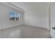 A well-lit bedroom with tile flooring, window with blinds, and recessed lighting at 2362 Datura Loop, St Cloud, FL 34772