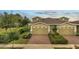 Inviting townhome featuring a brick driveway and well-maintained landscaping at 2362 Datura Loop, St Cloud, FL 34772