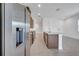 A stainless steel refrigerator complements the island's granite countertop at 2362 Datura Loop, St Cloud, FL 34772