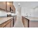 Modern kitchen with granite counters, stainless steel appliances, and wooden cabinets at 2362 Datura Loop, St Cloud, FL 34772
