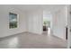 The living room features bright white paint, tile flooring, and entry to other rooms at 2362 Datura Loop, St Cloud, FL 34772