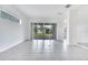 Bright living room featuring sliding doors to the backyard at 2362 Datura Loop, St Cloud, FL 34772
