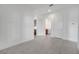 The open-concept living room boasts tile flooring, neutral paint, and entry to the laundry room at 2362 Datura Loop, St Cloud, FL 34772