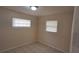 This cozy bedroom offers tile flooring and a window for natural light at 2422 Kingsland Ave, Orlando, FL 32808