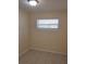 Cozy bedroom featuring tile flooring and a neutral color scheme for a comfortable and inviting atmosphere at 2422 Kingsland Ave, Orlando, FL 32808