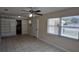 Living room with neutral paint, tile floors, a ceiling fan, and a window with blinds at 2422 Kingsland Ave, Orlando, FL 32808