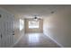 Living room with neutral paint, tile floors, a ceiling fan, and a window with blinds at 2422 Kingsland Ave, Orlando, FL 32808
