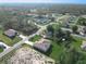 Aerial view of a home in a residential area with green lawns and mature trees at 2531 Sw 167Th Loop, Ocala, FL 34473