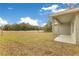 Expansive backyard featuring a covered porch and views of lush green space at 2531 Sw 167Th Loop, Ocala, FL 34473