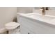 Stylish bathroom features a white vanity with quartz countertop and modern sink fixtures at 2531 Sw 167Th Loop, Ocala, FL 34473