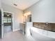 Relaxing bathroom featuring a soaking tub, modern fixtures, and stylish vanity at 2531 Sw 167Th Loop, Ocala, FL 34473