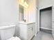 Well-lit bathroom with white vanity and modern fixtures, alongside an open closet at 2531 Sw 167Th Loop, Ocala, FL 34473