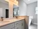 Bathroom with double vanity and sinks, modern fixtures, a soaking tub, and a glass-enclosed shower at 2531 Sw 167Th Loop, Ocala, FL 34473